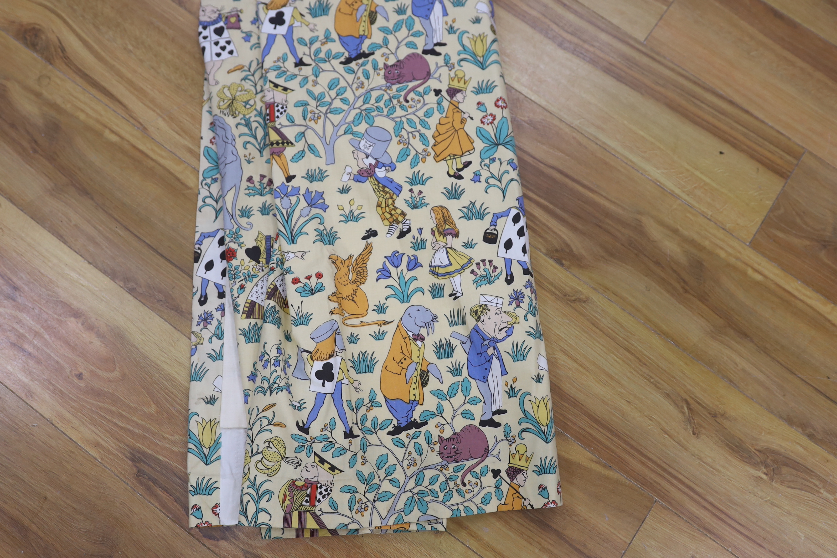A late 1980’s vintage curtain of Alice in Wonderland, design originally by C. F. A. Voysey; selvage printed; The Habitat V&A collection, 130cm wide at the bottom, 130cm long